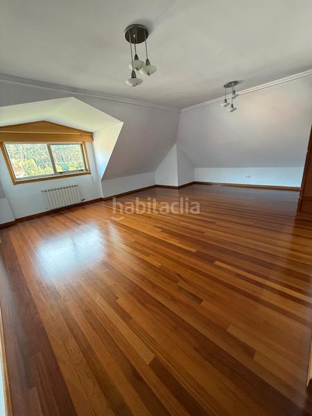 Foto 22c56ed7-d942-4cdd-b2af-27f45e2336b8. Àtic amb calefacció a O Milladoiro Ames