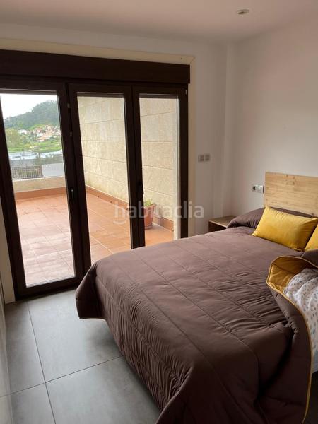 Foto 8d25ad12-3ccd-46ab-bcc5-829347020af4. Piso  muy luminoso en seixo, . la vivienda se distribuye en dos habitaciones con armarios empotrados lacados en blanco y salid en Marín