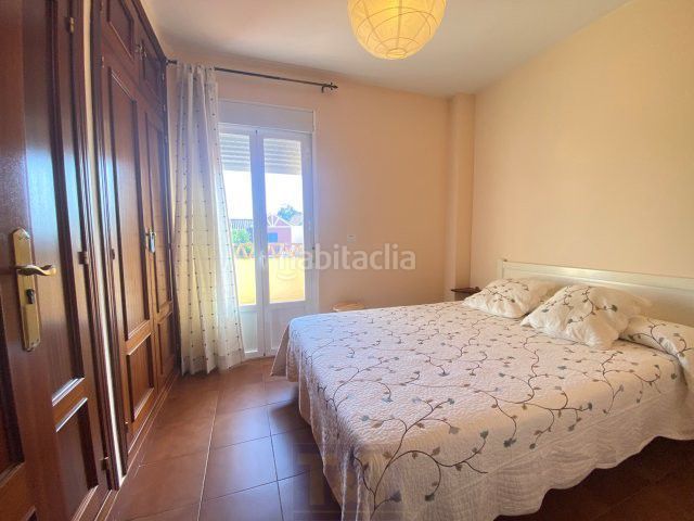 Foto 016e8326-61bd-4444-ba67-ecabc23f355a. Casa adossada amb aparcament a Islantilla golf Islantilla