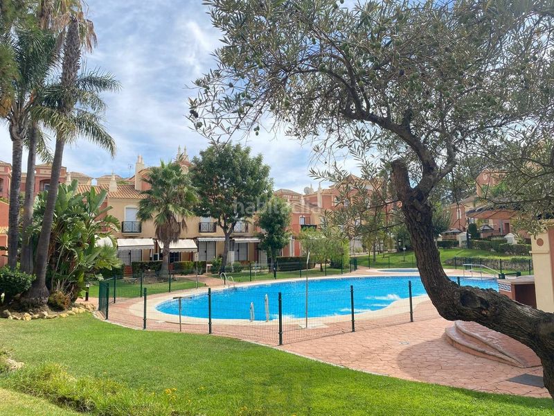 Foto 987b3f6b-fa0f-4307-85f8-8c63c29b79ff. Casa adossada amb aparcament a Islantilla golf Islantilla
