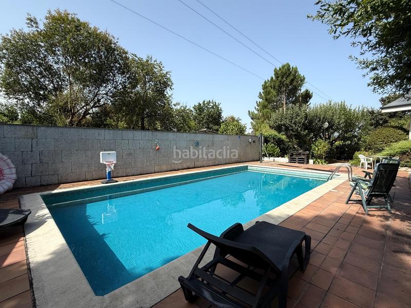 Foto 300a19e1-93fd-4ccc-9bdd-7b6e22699fe0. Casa en venda (a)-san martiño 71 casa con terreno y piscina en a derrasa en Pereiro de Aguiar (O)