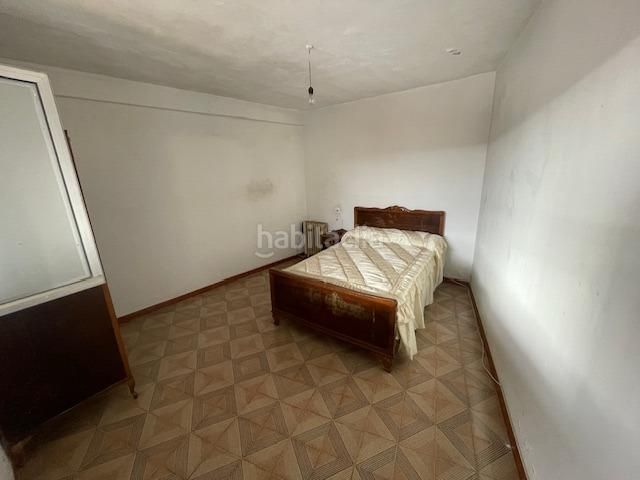 Foto c11dce37-7613-4dc6-86bf-2f67114c1a00. Casa adossada amb aparcament a Irixo (O)