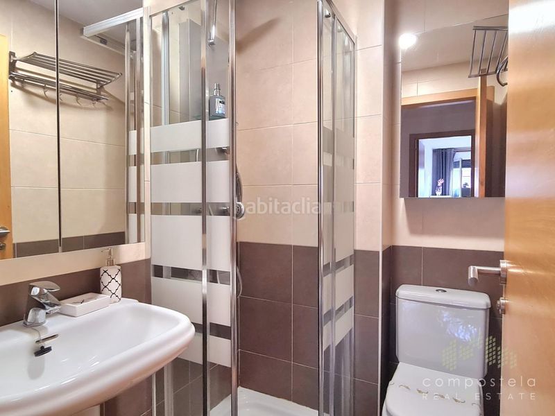 Foto f1427247-4d92-4f4a-b134-035c233bf49b. Rent flat with heating parking in O Milladoiro Ames
