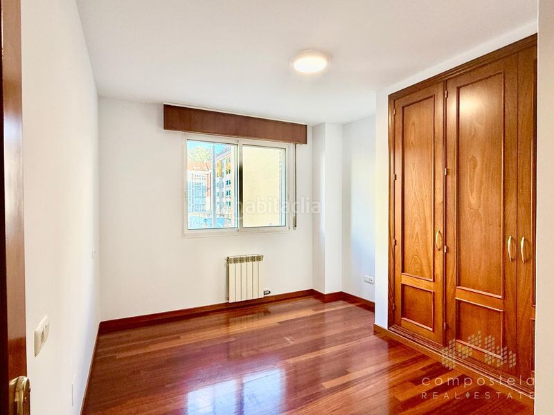 Foto 411a3f4e-aacb-4dba-a797-109e36268933. Flat with heating parking in O Milladoiro Ames