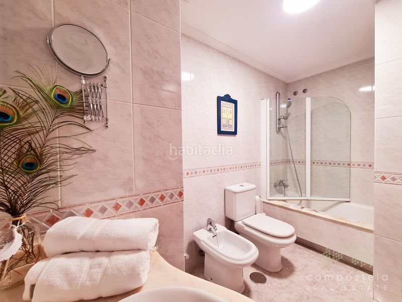 Foto f8d59b22-4616-426c-a86c-566257113116. Flat with heating parking in O Milladoiro Ames