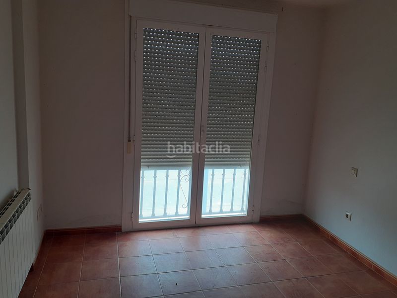 Foto ce9d8703-7dfe-48e9-95a9-58b072092dbd. Casa adosada unifamiliar adosado en barrio residencial. en Malagón
