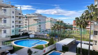 Apartamento en Daimús. Bonito apartamento en primera línea de playa de daimús. con pisc