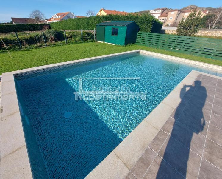 Foto e5871296-34c4-46c5-9dd2-d2c402acdbe3. Xalet amb calefacció aparcament piscina a Carnota