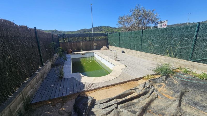 Foto 557811d0-5a5f-42af-9fed-e2deac8946ba. Casa adossada amb aparcament piscina a Bescanó