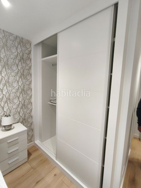 Foto 8d16e935-1a2c-492b-ac9d-274e21c42b90. Rent flat with heating parking in O Milladoiro Ames