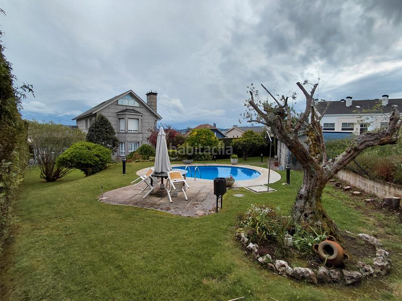 Foto 6c00fd74-b735-4c94-bec9-7119cc4c4802. Chalet avec cheminée chauffage parking piscine dans Oleiros