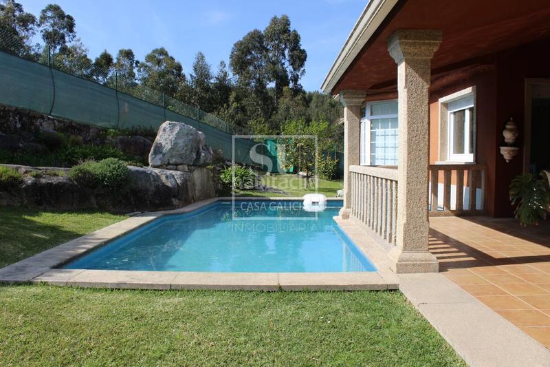 Foto 77a066d8-5a42-4d59-ac7f-7cc669eb28b7. Chalet con riscaldamento parcheggio piscina in Baiona