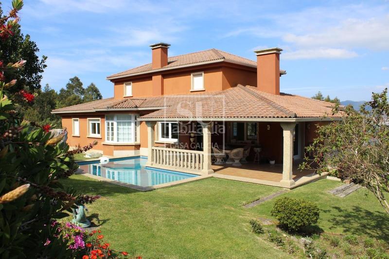 Foto af7412b3-bef4-4fb7-9637-0661e30b8354. Chalet con riscaldamento parcheggio piscina in Baiona