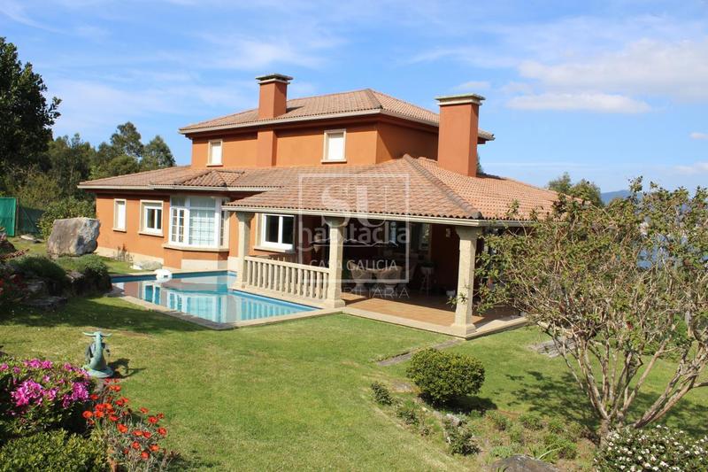 Foto d0bcf757-87fb-48ba-9b1c-e8aefb93a624. Chalet con riscaldamento parcheggio piscina in Baiona