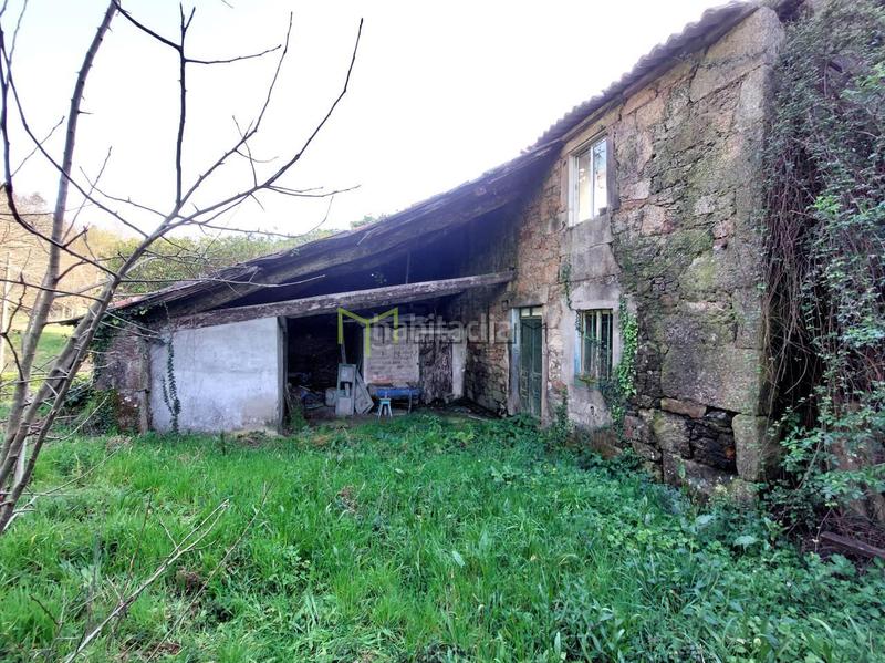Foto d38c082d-98c9-406b-8f09-8a69254ce9ff. Maison avec parking dans área de Ames Ames