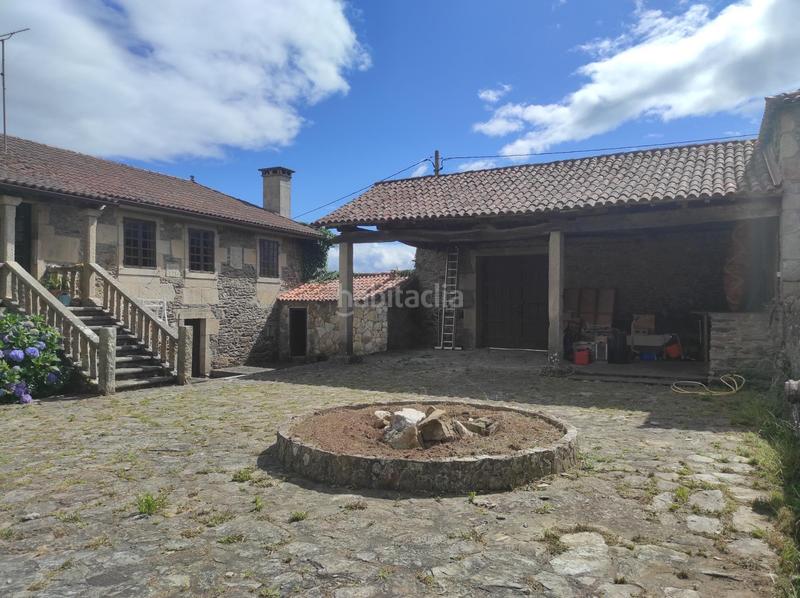 Foto 58c25a65-1139-4e37-8b6f-550c574d4055. Casa  de piedra con finca en lalin en Lalín