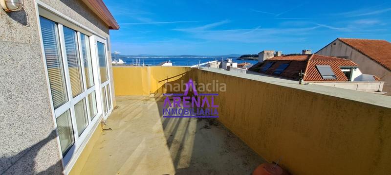 Foto f8026e7b-685f-409d-b683-c63a4635e590. Casa adosada casa céntrica con vistas y terraza en Pobra do Caramiñal (A)