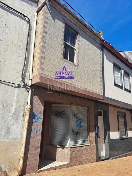 Foto ff58afbf-5d0c-4a55-8463-ca934e925e08. Casa aparellada a Pobra do Caramiñal (A)