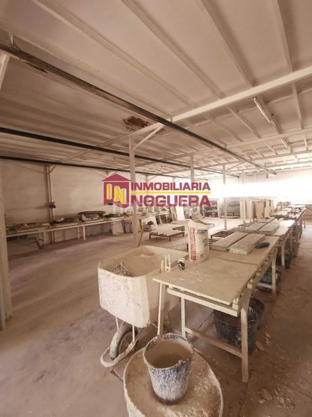 Foto c9a18e9a-3d60-4c8b-8b5e-a8188dd61e3d. Nau industrial a Écija