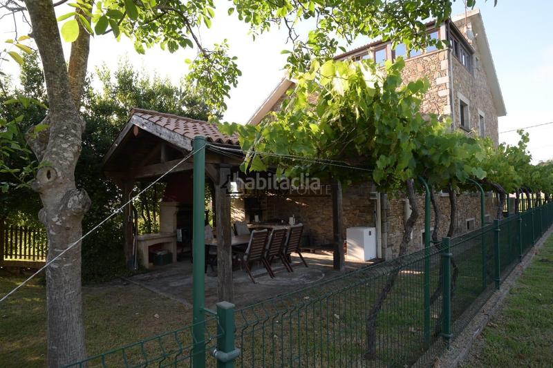 Foto 3add41a4-a368-44ce-8542-43a788f38db3. Casa chalet de piedra con viñedo, árboles frutales y vistas al mar sanxenxo en la exclusiva zona de casal, a tan solo tres minutos en en Meaño