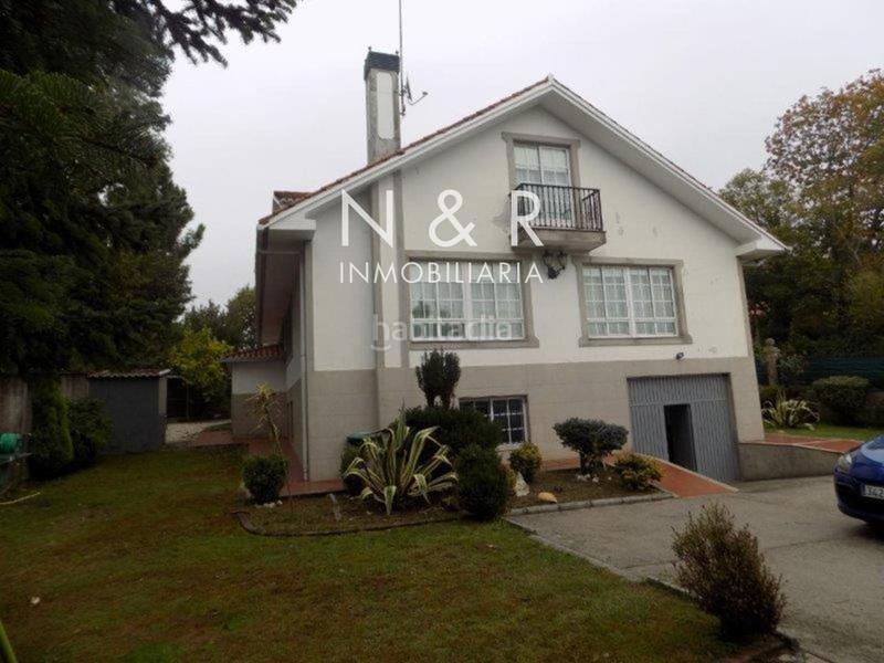 Foto 32c8565a-0179-47d0-ba6a-c1b7ded3e457. Casa  con jardín en venta en O Milladoiro calle magdalane en Ames