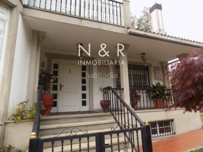 Foto 433efaf8-db72-48ef-9921-7ab74245f231. Casa  con jardín en venta en O Milladoiro calle magdalane en Ames