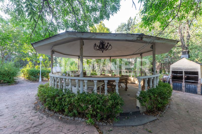Foto b3fde0b2-17af-4b64-8651-8318a3617600. Chalet with fireplace heating parking pool in Molino de la Hoz Rozas de Madrid (Las)