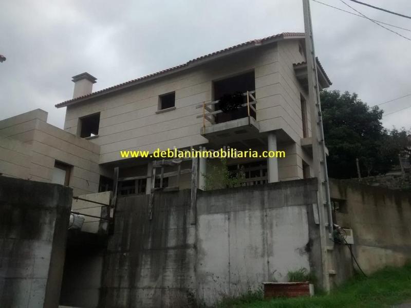Foto 19b0359e-f832-42bd-b5ac-34220c3d0bcf. Casa adossada amb aparcament a Moaña