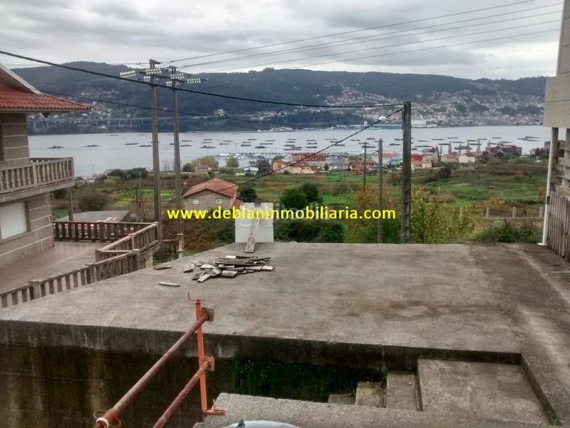 Foto 92768156-ea53-4594-8fe4-f06e0f6048b5. Casa adossada amb aparcament a Moaña