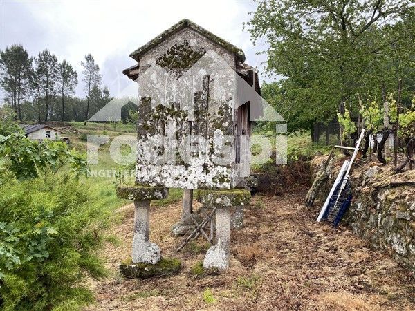 Foto fdc61aa6-fe42-488e-9991-8d46f6578a75. Casa adossada a Crecente