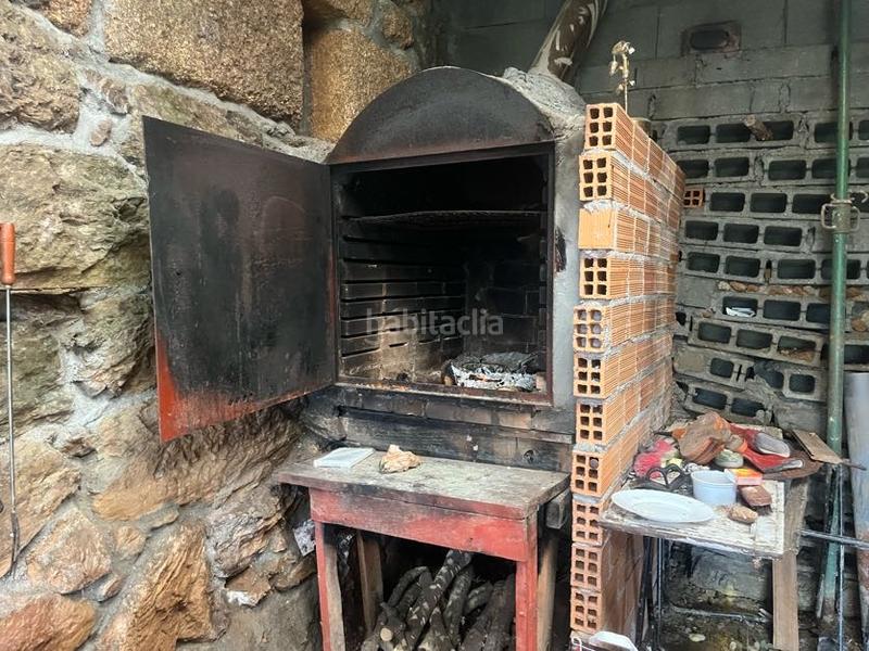 Foto f926df6d-a8bc-4ccc-b77e-79cb89891e8b. Casa con camino riscaldamento in Castrelo de Miño