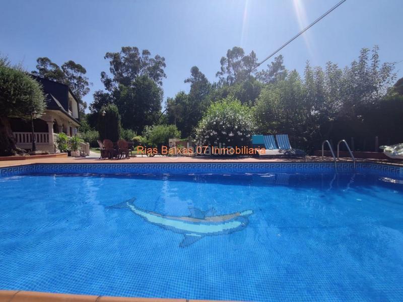 Foto 7cf7c711-bd48-4fe5-a07c-496cfa538538. Casa ref 2914 chalet 5 dorm. con jardín y piscina muy próximo mondariz balneario en Ponteareas