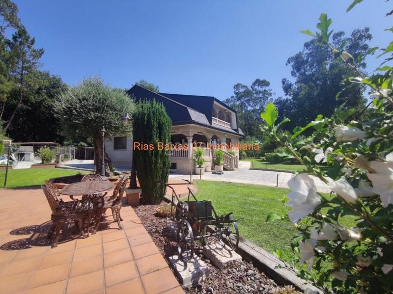 Foto c14b08fb-3f5b-4627-ae5f-75414ccd7643. Casa ref 2914 chalet 5 dorm. con jardín y piscina muy próximo mondariz balneario en Ponteareas