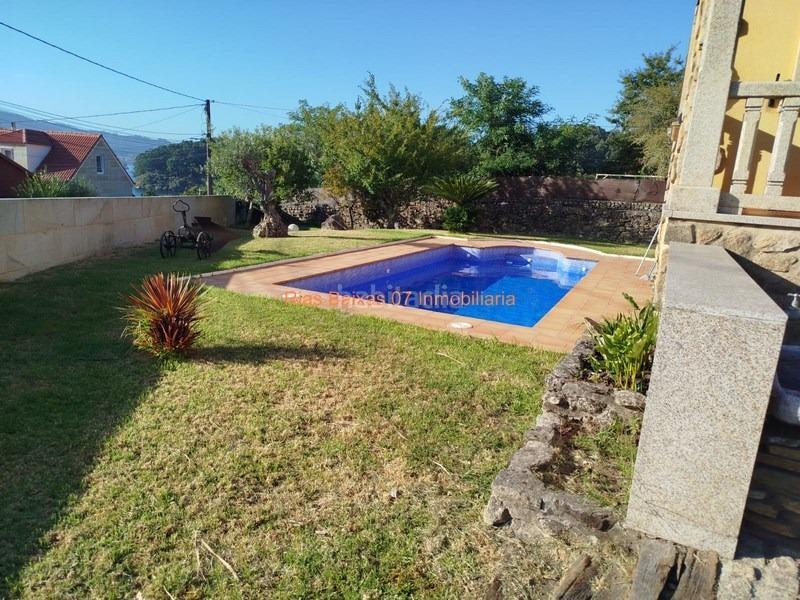 Foto 186d66e2-c886-4723-8b01-98fc7b98a6c1. Casa ref 7004 chalet 4 dorm. con piscina y vistas al mar en Redondela