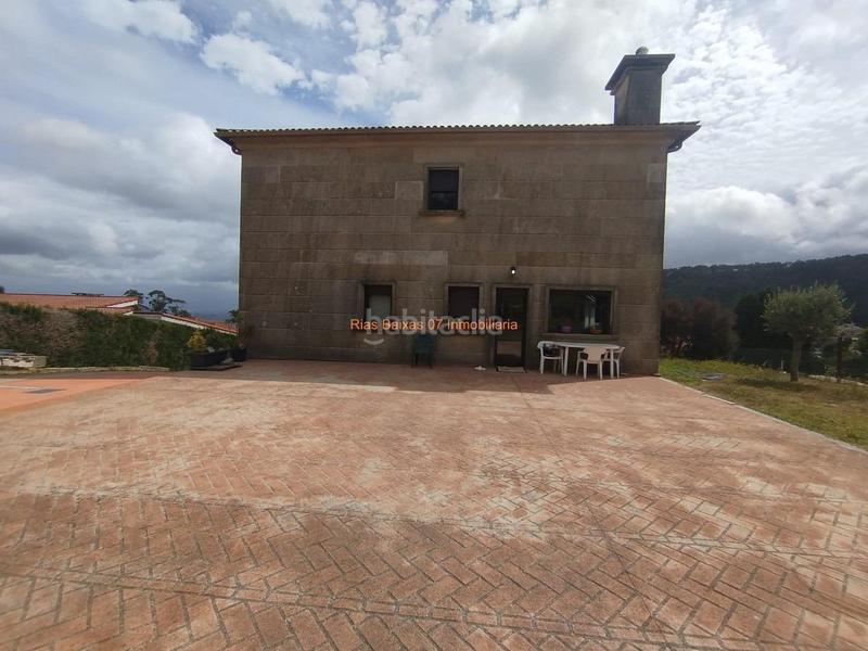 Foto 0cabd12f-e7cd-4212-a5af-d128a3aab524. Casa ref 7005 chalet de piedra 6 dorm. con vistas despejadas zona alta mos mos en Vigo