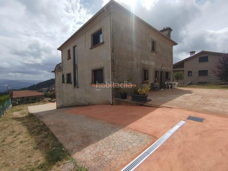 Foto 7da7beb2-e235-465a-9e2d-8e784d446d64. Casa ref 7005 chalet de piedra 6 dorm. con vistas despejadas zona alta mos mos en Vigo