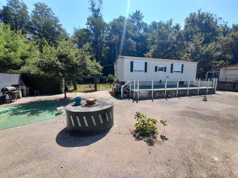 Foto f7fe5896-5719-497d-aaa9-147dbd38776f. Casa  prefabricada, 2 dormitorios, amueblada, con luz, agua y calefacción. parcela cerrada con portal automático. en Ponteareas