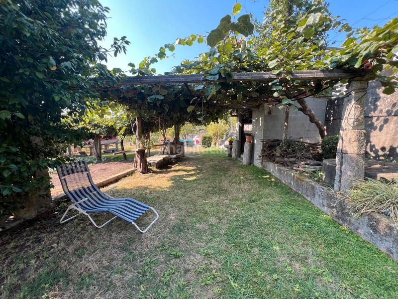 Foto c6634a54-2251-46df-a83c-c9afbb70ef0c. Chalet casa de piedra de 4 dormitorios, parcela 3880m2 en Neves (As)