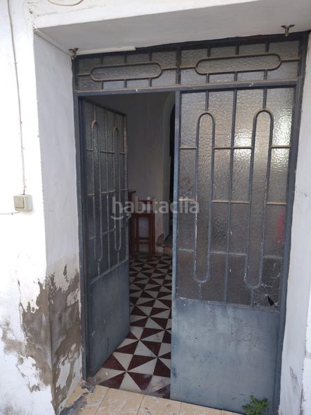 Foto b58f174f-06a1-454a-ab8e-035c878cbd28. Casa adossada a Chucena