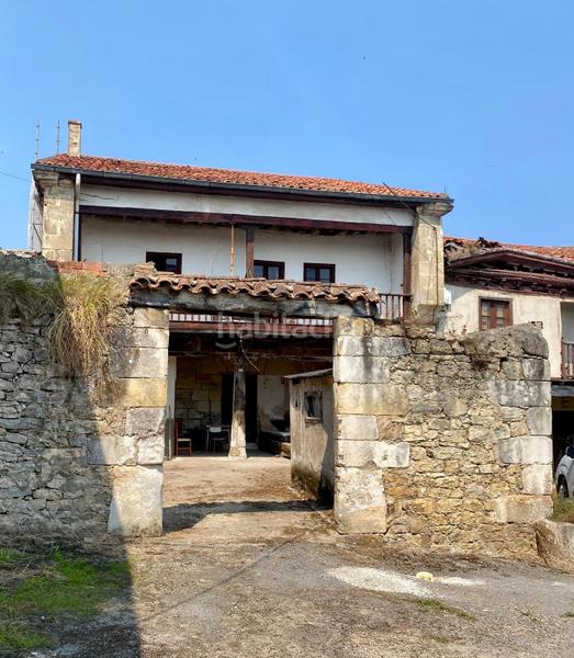 Foto e7863266-c70a-4cee-969c-e4cea4efd9c3. Casa adosada  de piedra estilo montañés en Reocín