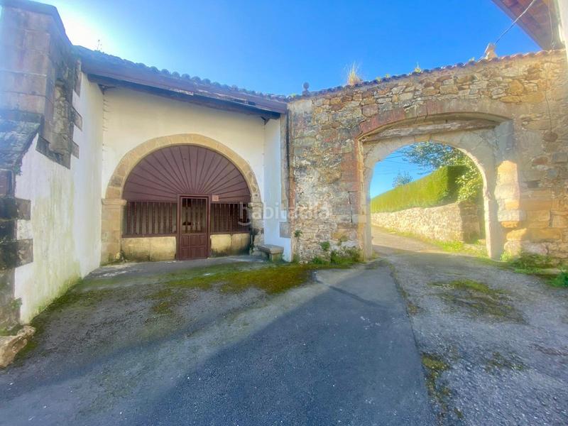 Foto ebe5e4ab-90bf-484e-a48e-d59d88db49fe. Casa adosada  de piedra estilo montañés en Reocín