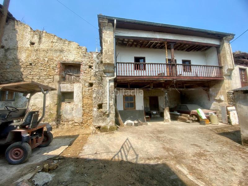 Foto ec7cf014-c3f0-4e8d-b5e2-63b1fd539e60. Casa adosada  de piedra estilo montañés en Reocín