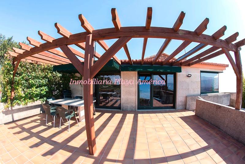 Foto 0c524b88-340a-4c26-b7b3-6c2a41ee93f5. Chalet bonita casa rústica, con piscina y vistas al mar. en Nigrán