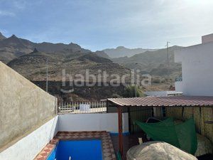 Foto 2e412731-4728-4630-8921-3236596a6b41. Casa aparellada amb aparcament piscina a Los Almacigos - Veneguera Mogán