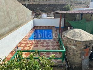 Foto ef7de640-5241-48da-9520-2ebbff0cb59e. Casa aparellada amb aparcament piscina a Los Almacigos - Veneguera Mogán