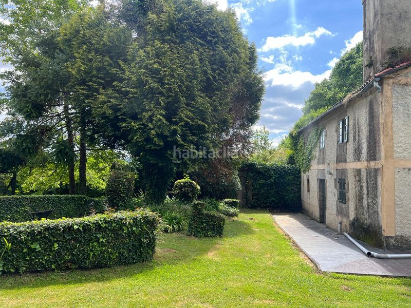 Foto cf639b6f-c273-40bb-8953-4fa852d4a941. Casa aparellada amb aparcament a Cambre