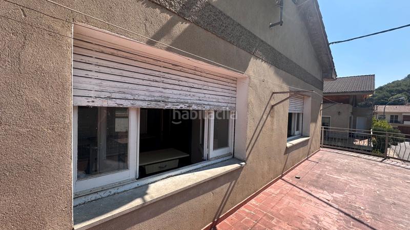 Foto 401e13e0-a9cb-46b0-b18e-e27a9ef56f25. Casa aparellada a carrer dels paperers 12 a Sant Joan les Fonts