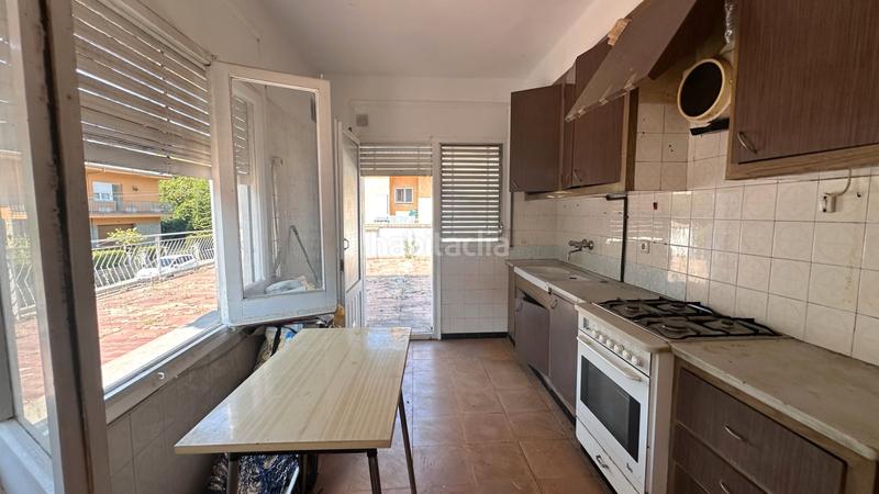 Foto f40c26f5-964c-46b1-b539-9253181f1f99. Casa aparellada a carrer dels paperers 12 a Sant Joan les Fonts
