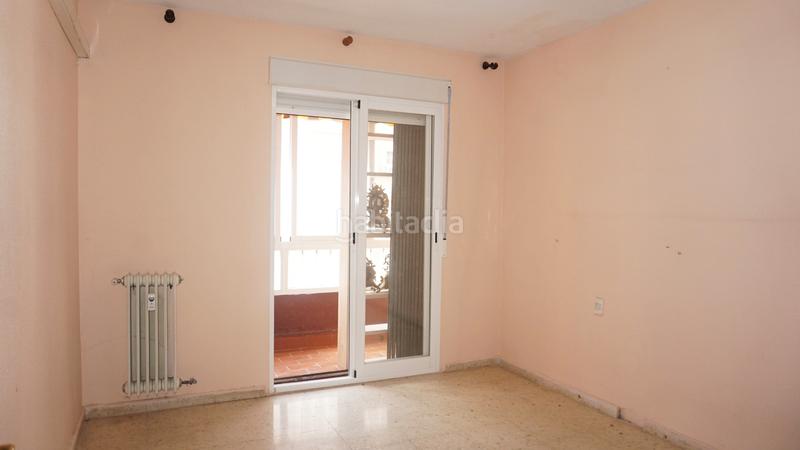 Foto 2c40106c-0806-492e-ad90-24cb943c4a03. Piso  a la venta en alminares en Cervantes Granada
