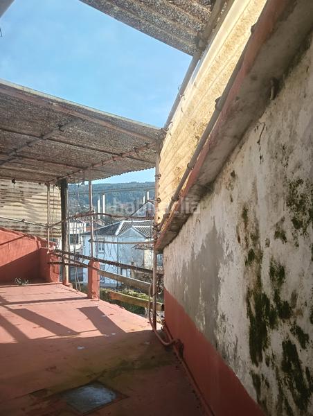 Foto b5ce2e0b-8870-4648-aeee-f717552fd016. Casa adosada en Fene